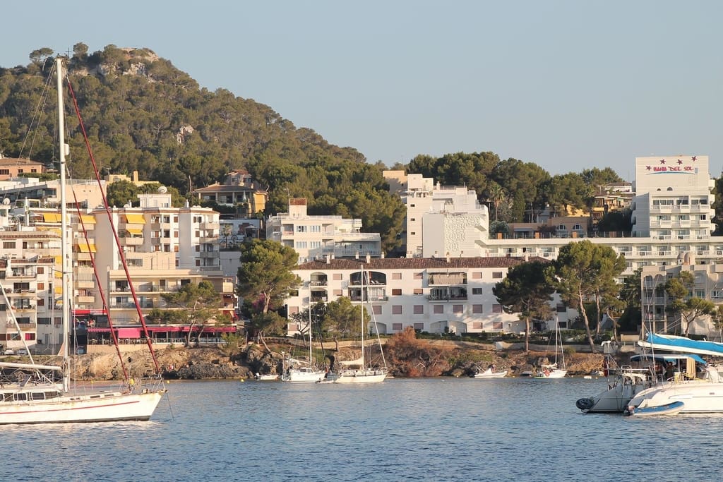 boats-on-the-sea-with-houses-island-in-background-in-santa-ponsa-majorca-spain