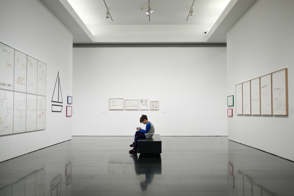 boy-sitting-in-an-art-gallery