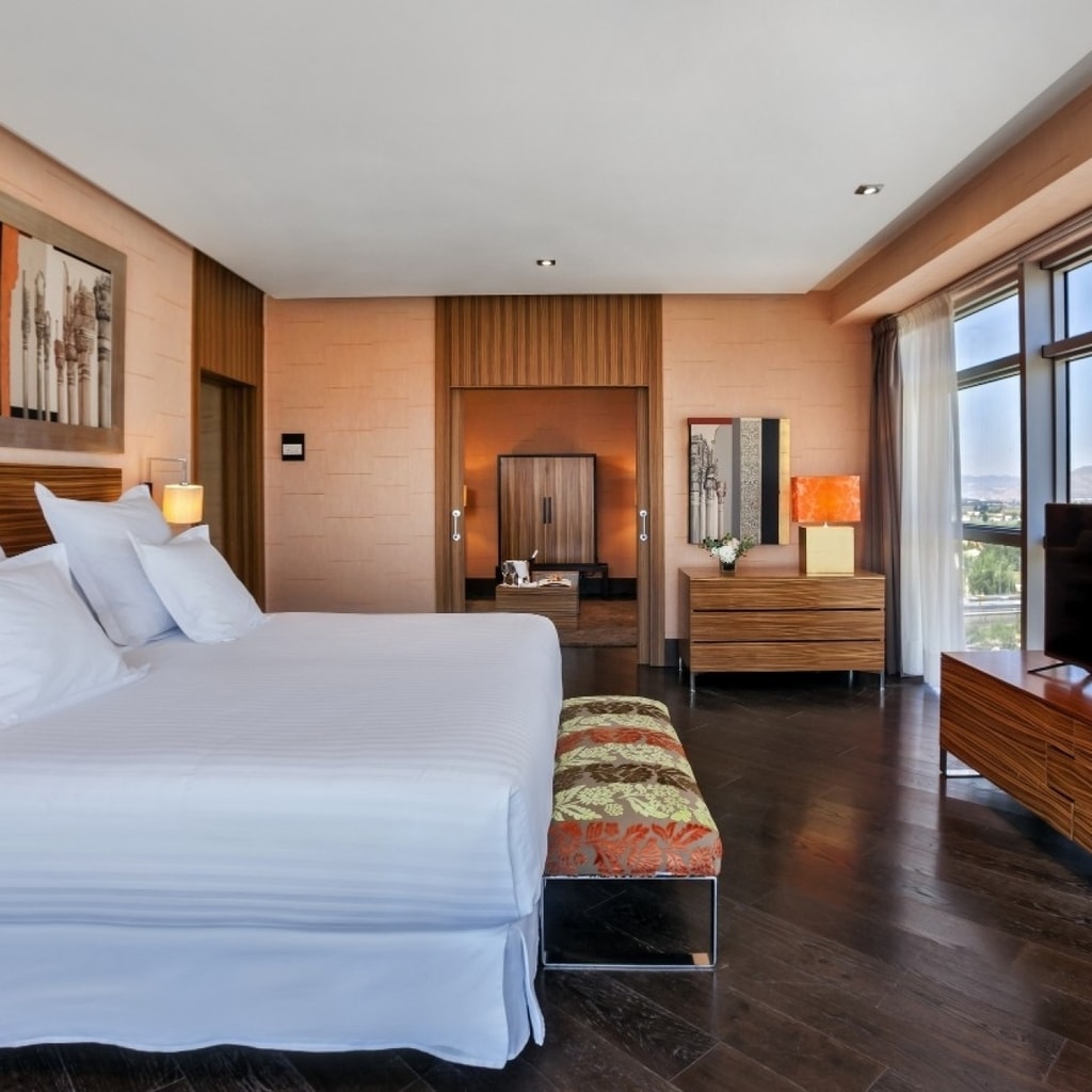 Brightly lit bedroom in Barcelo Granada Congress Hotel