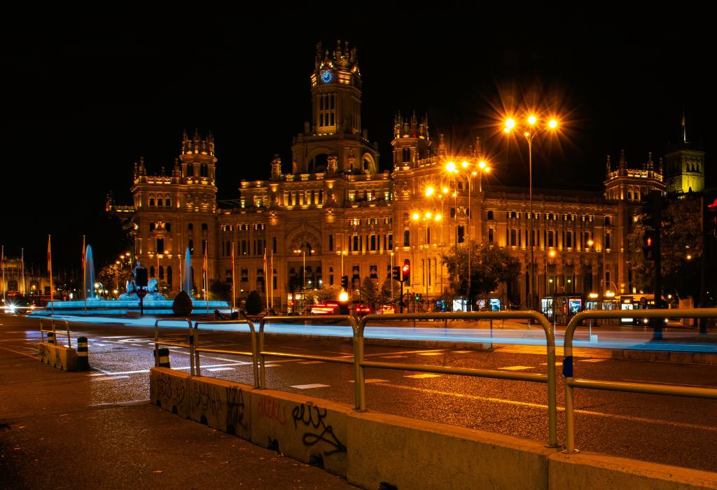 Madrid palace lit up at night.