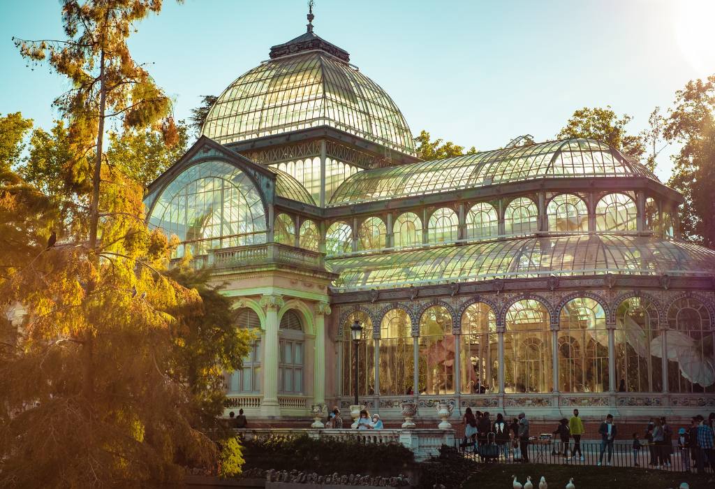 Large glass greenhouse in the sunlight.
