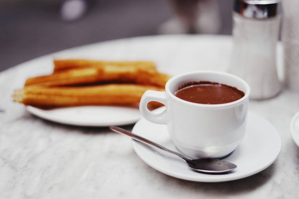 Cup of hot chocolate with churros