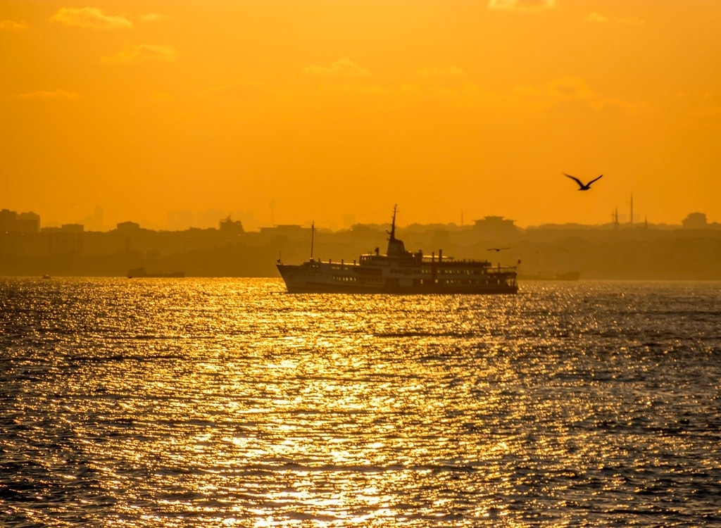 Ferry at sea in the sunset.