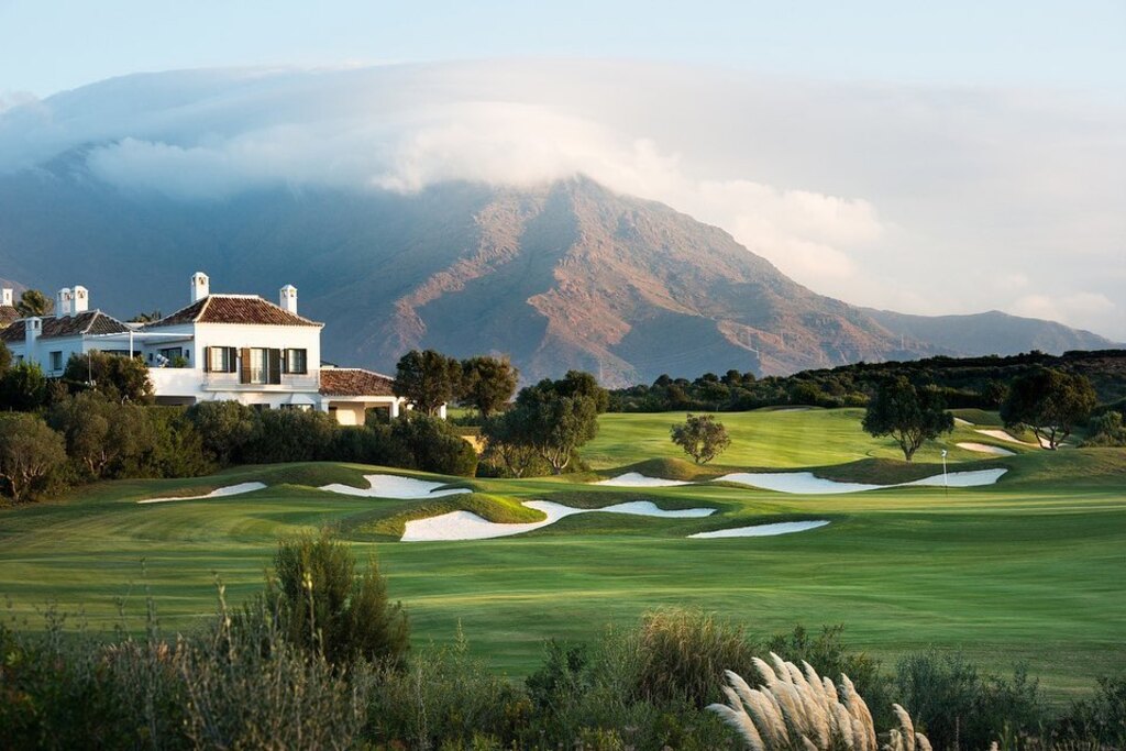 Golf course of Finca Cortesin hotel in Spain with mountains in background