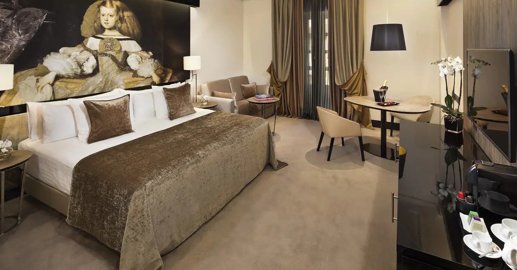 Gran Melia Hotel room with white and brown tones 