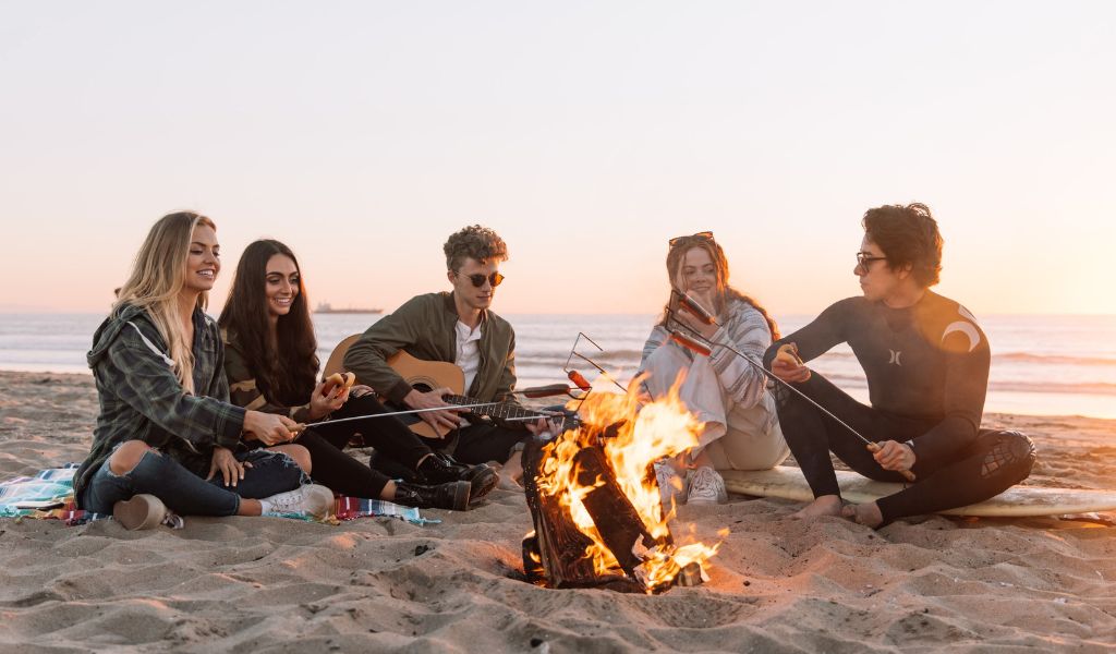 Group having a bonfire on a beach