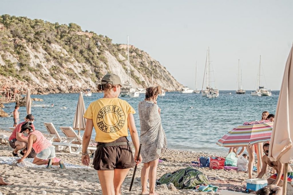 people on the beach of ibiza island
