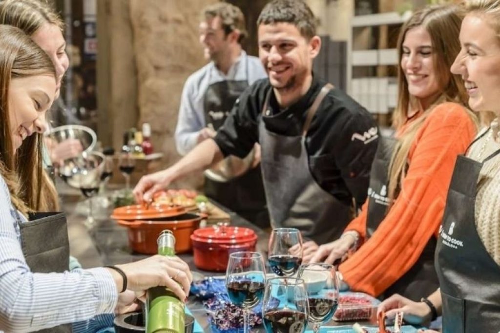People making food and enjoying a cooking class