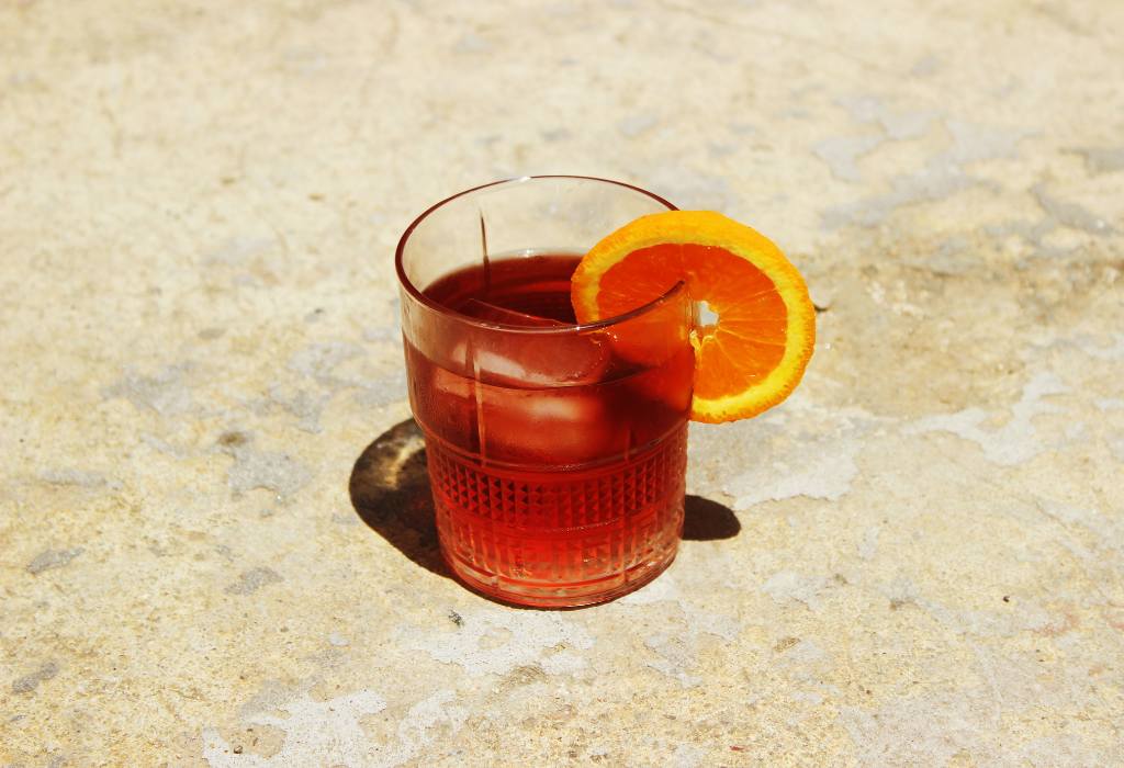 Orange drink on the ground.