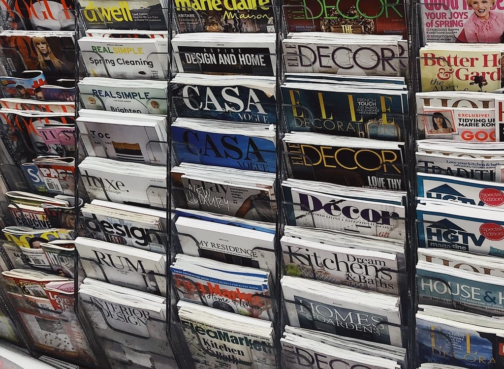 Image of a magazine rack with an different magazines.