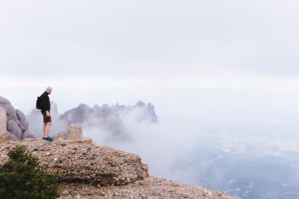 Man hiking the summit of Montserrat mountain in the fog
