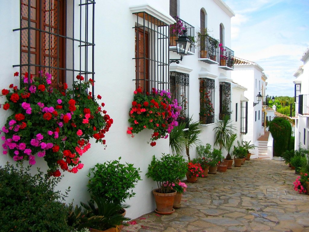Marbella old town with flower pots on buildings