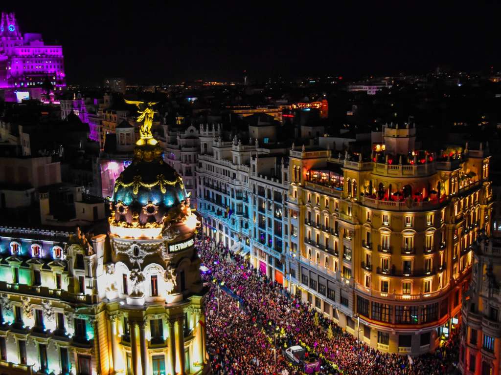Vibrant colours and lights during a night time festival celebration in Madrid