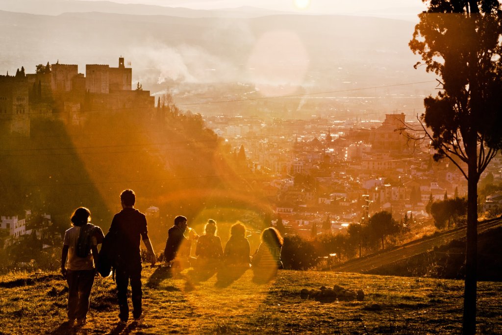 People watching the sunset in Granada, Spain