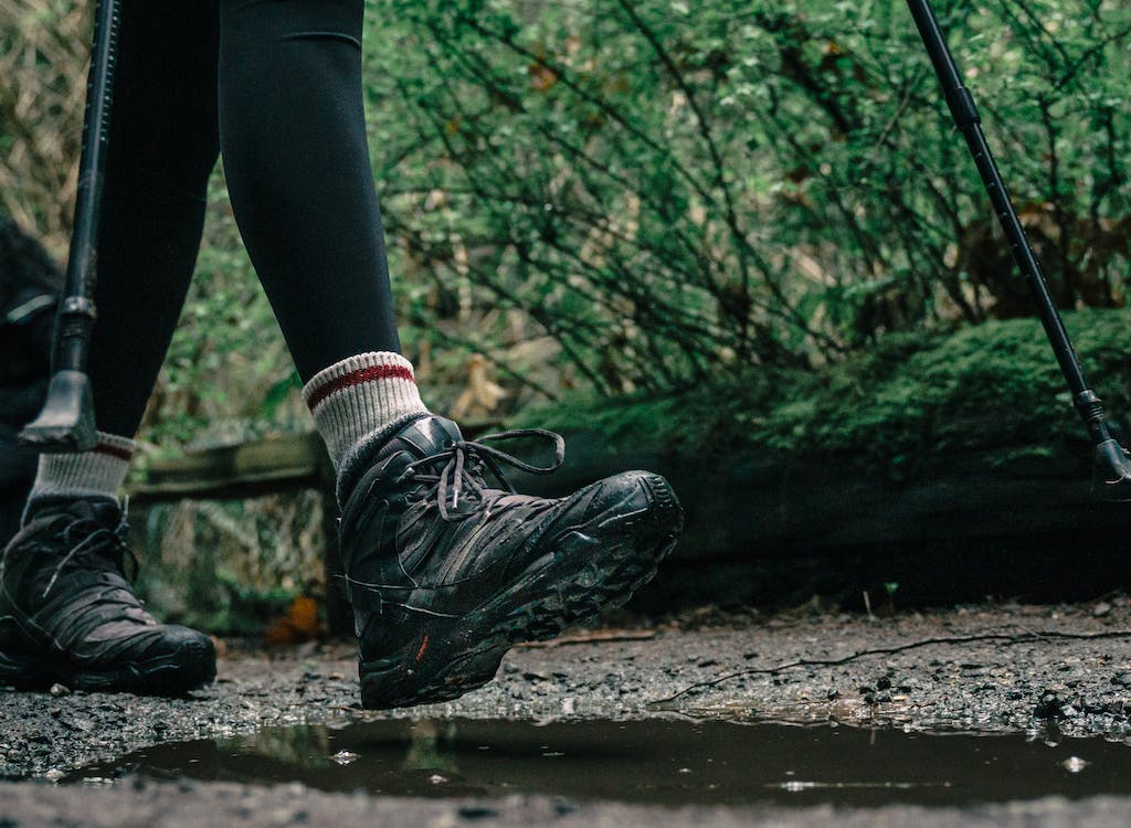 Close up image of hiking boots of someone hiking.