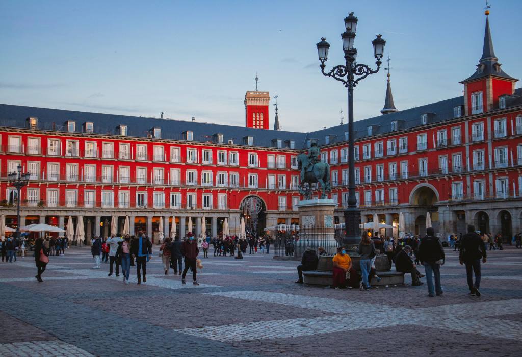 Red building with cobblestone streets.