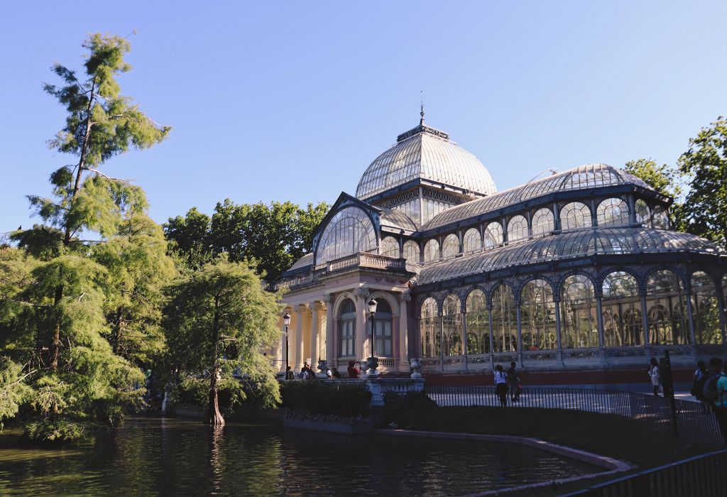 Big glass greenhouse in park.