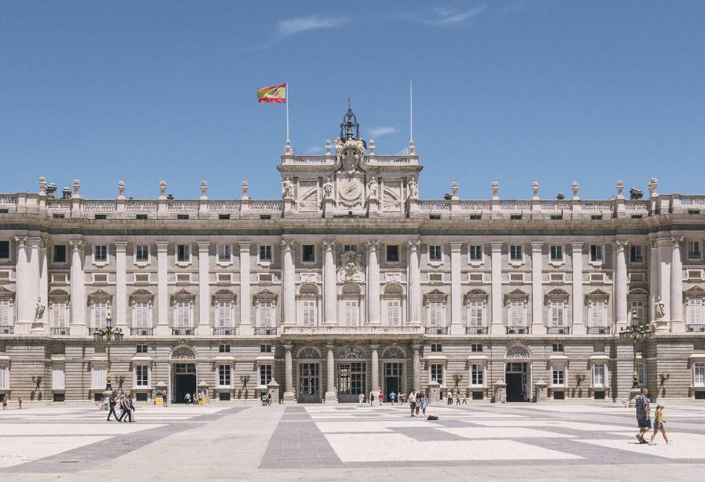 White palace building with blue skies.