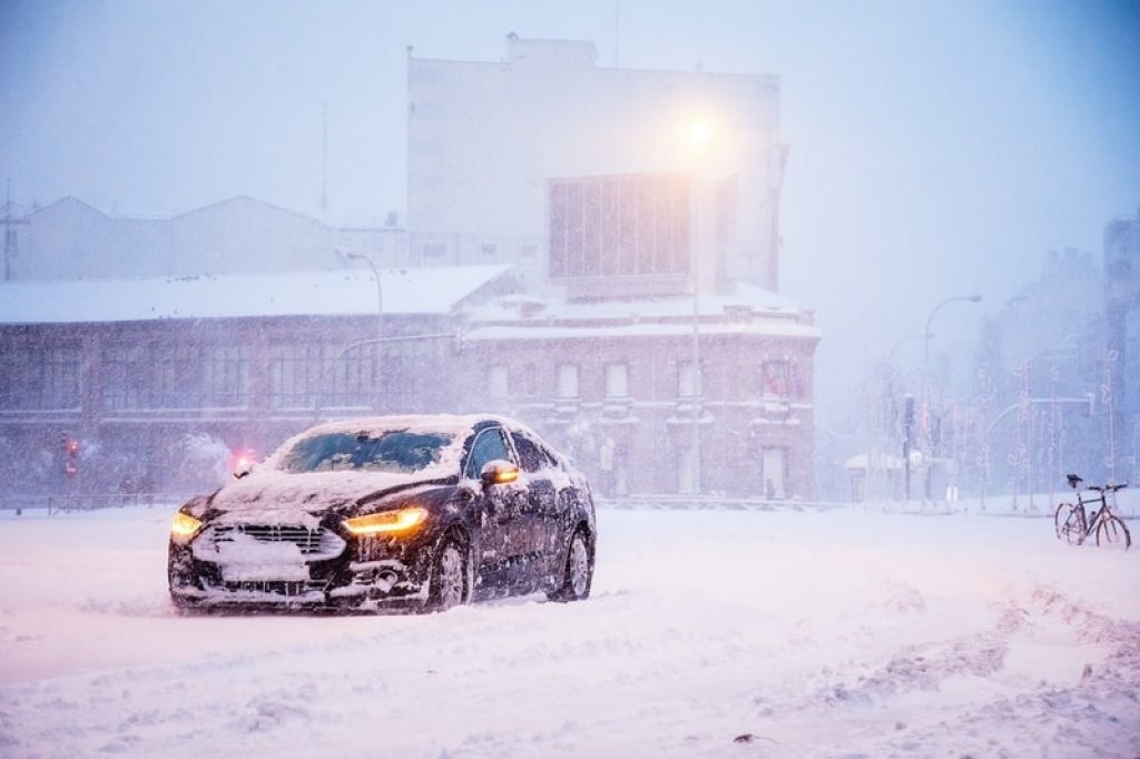 car-covered-in-snow-in-winter