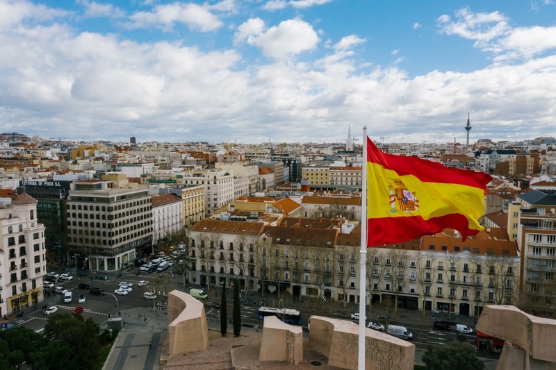 spanish-flag-infront-of-spain-backdrop