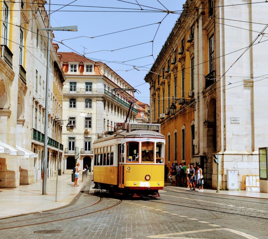 Yellow tram riding in Porto, Portugal