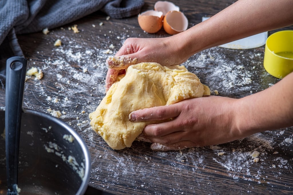 Person making pasta dough