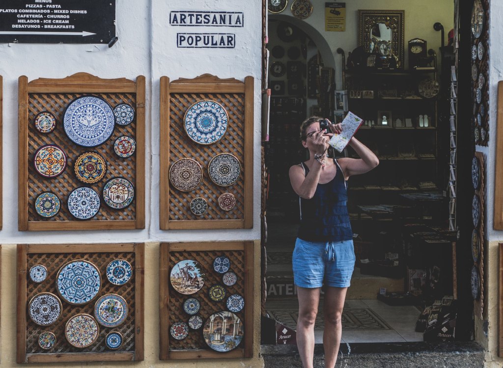Tourist taking a photo at a museum