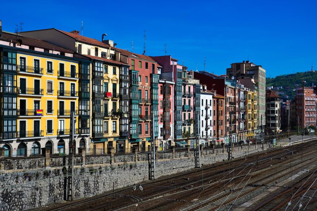 Image-of-train-tracks-next-to-colorful-buildings