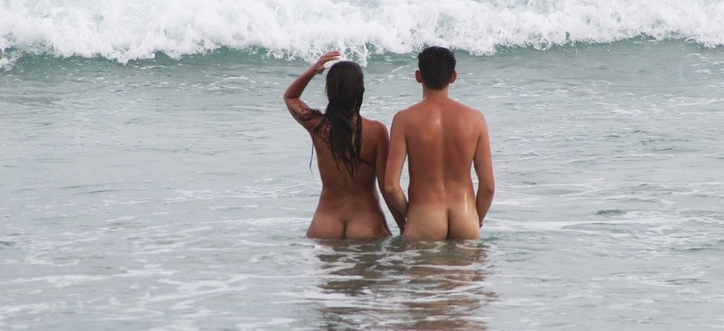 two nude people in water