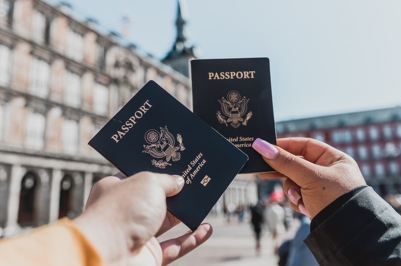 two-hands-holding-passports-in-spain