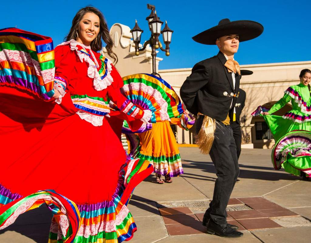 Man and woman dancing in a street parade in Madrid