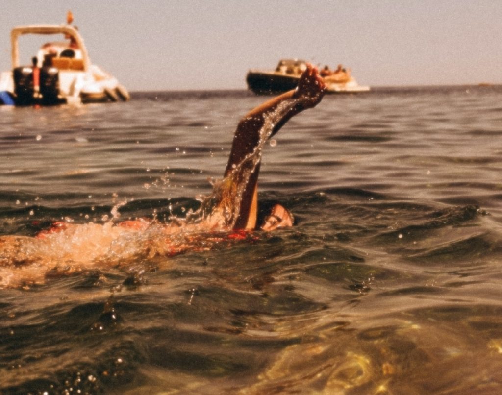 Woman swimming in the ocean